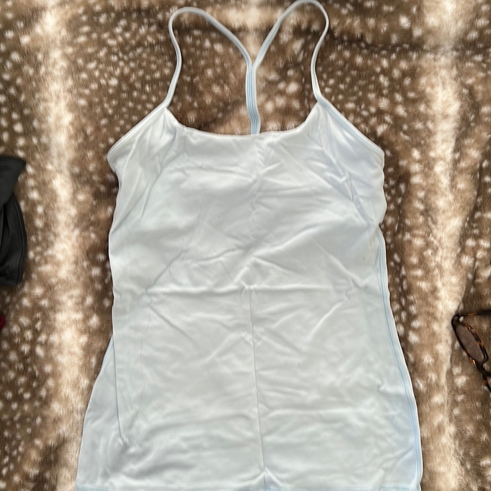 Light blue lululemon athletic too with built in sports bra in fair condition